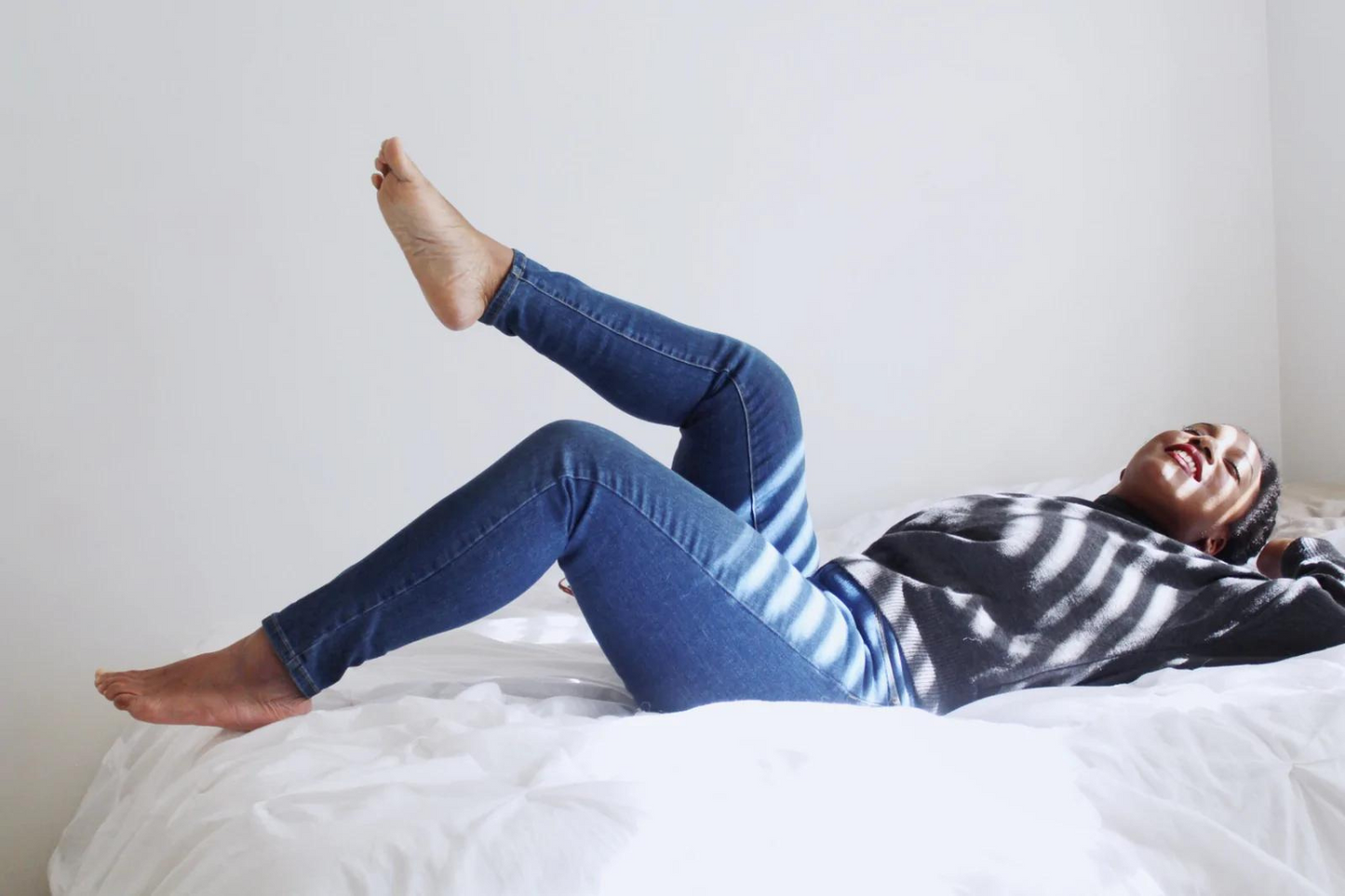 A woman resting on Nollapelli's soft sheets