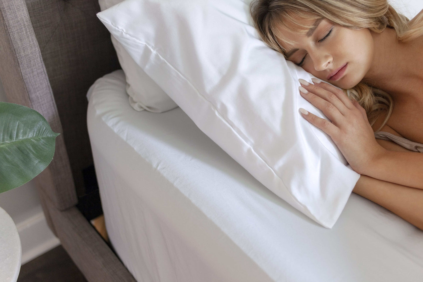 A woman resting on Nollapelli's soft pillowcase