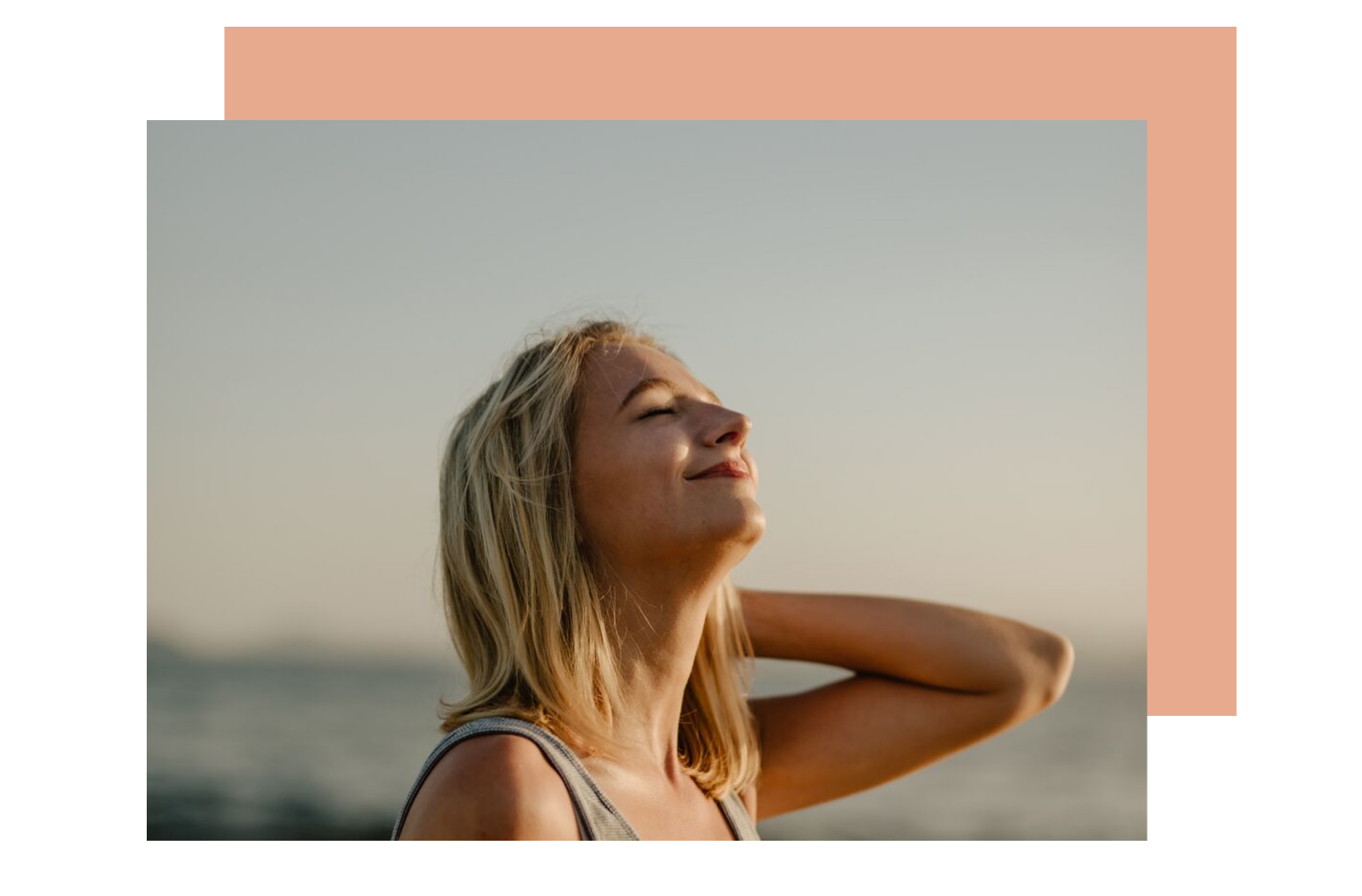 A woman outside looking peaceful