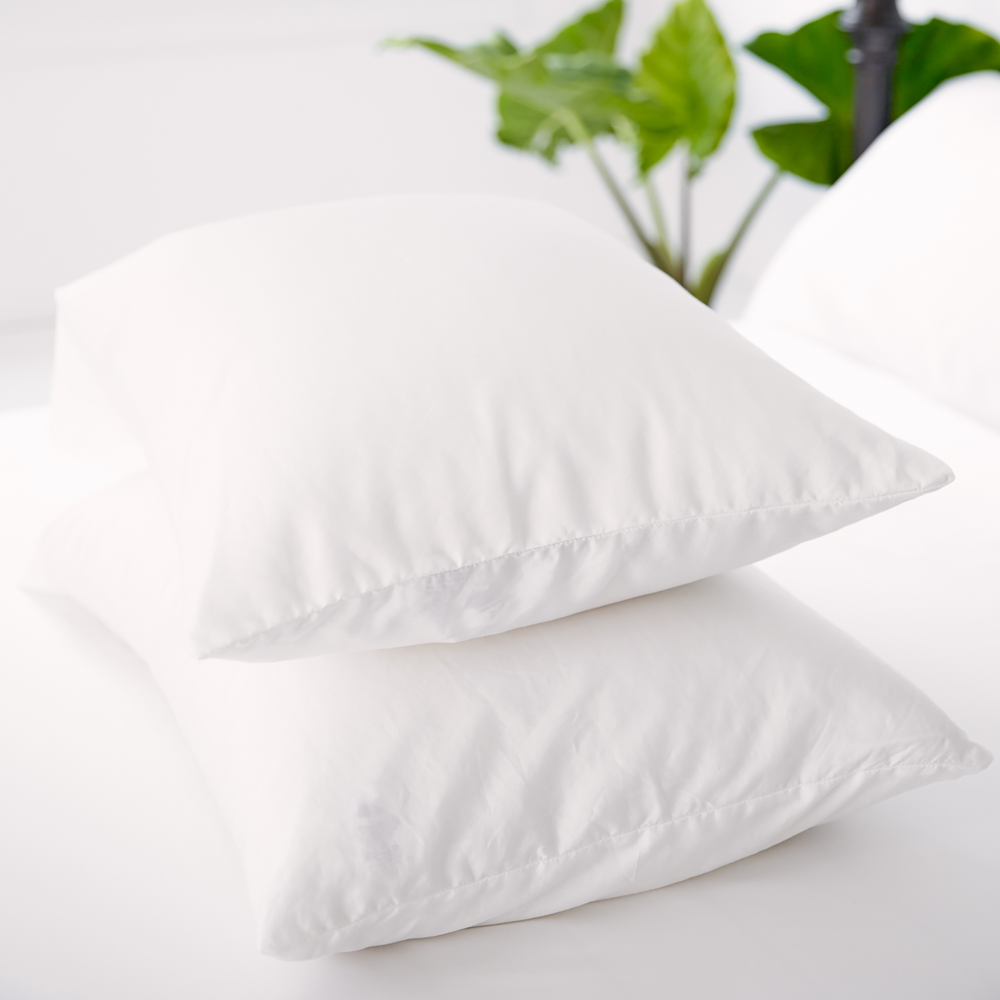 
                  
                    Nollapelli two white pillowcases on top of bed
                  
                
